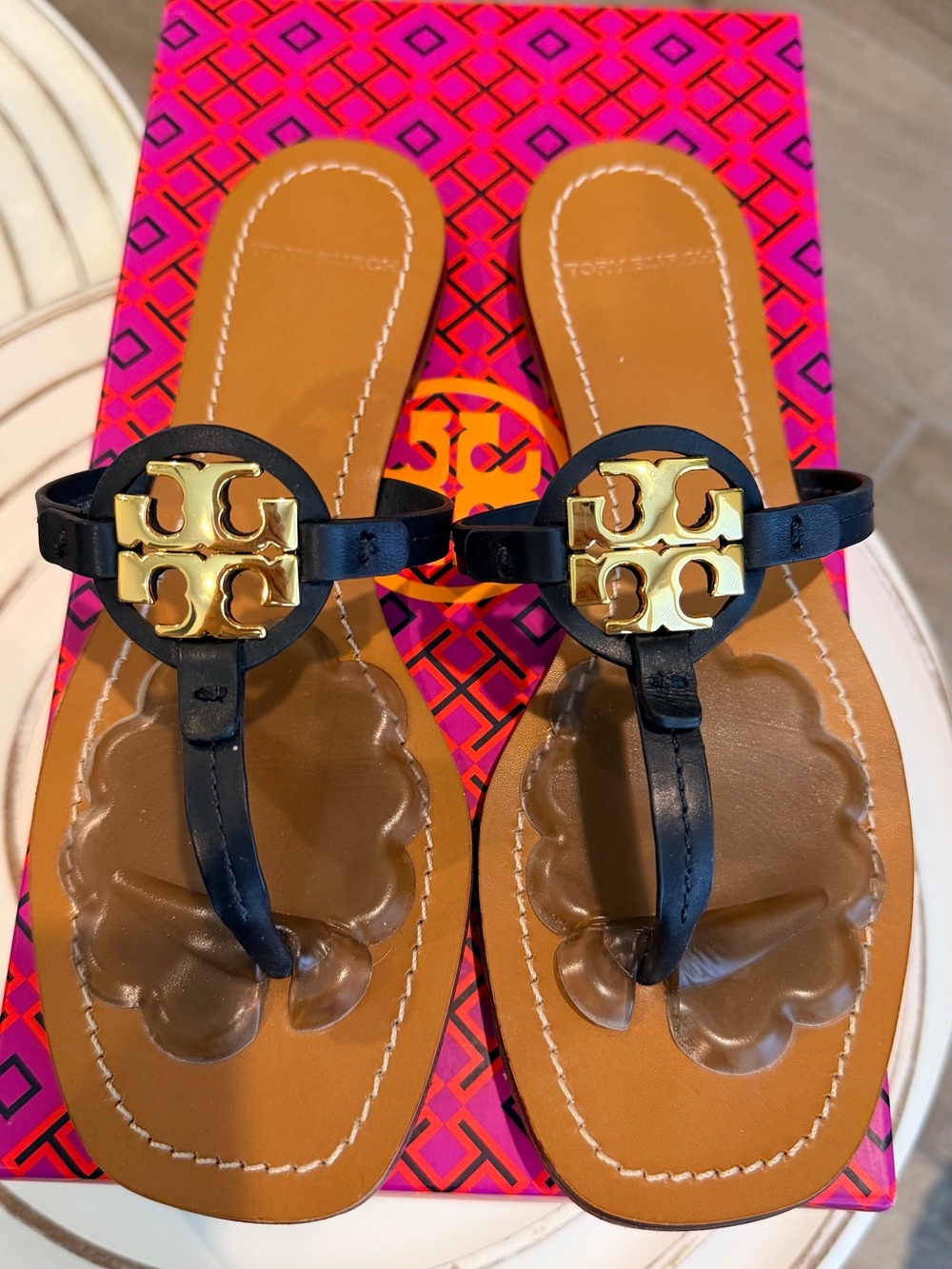 Tory Burch Black Leather Thong Sandals with Gold Logo Medallion